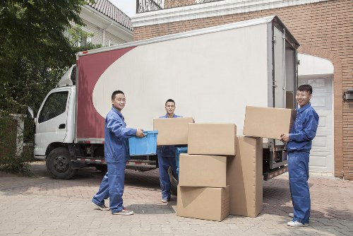 Calculator and moving boxes representing load-based and cubic-yard rates