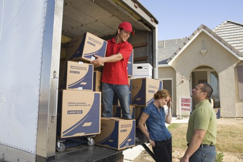 Professional man and van transporting boxes in Yeading